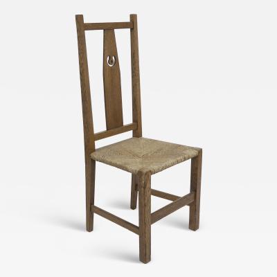 Mackay Hugh Baillie Scott M H Baillie Scott attributed An Arts Crafts oak chair with pierced decoration