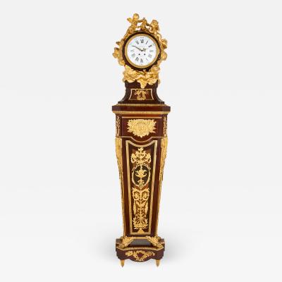 Mahogany and gilt bronze Rococo pedestal clock after Riesener