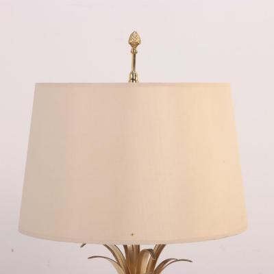 Maison Charles French brass and polished steel table lamp attributed to Maison Charles C 1950 