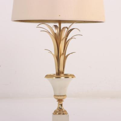 Maison Charles French brass and polished steel table lamp attributed to Maison Charles C 1950 