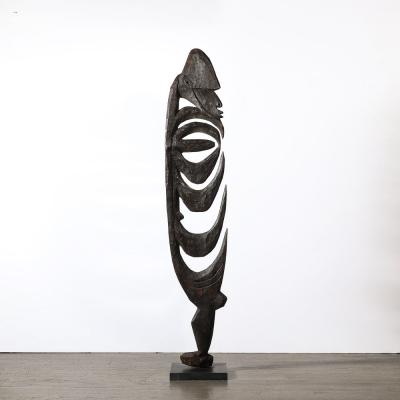 Male Yipwon Figural Carved Wood Sculpture on Stone Base