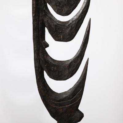Male Yipwon Figural Carved Wood Sculpture on Stone Base