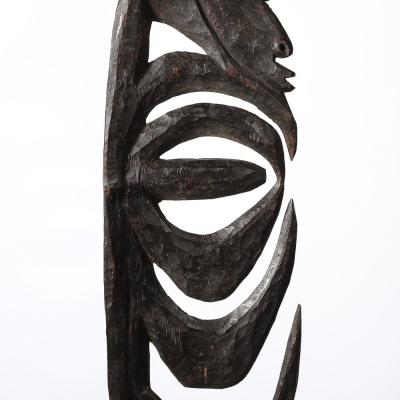 Male Yipwon Figural Carved Wood Sculpture on Stone Base