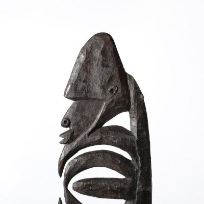 Male Yipwon Figural Carved Wood Sculpture on Stone Base