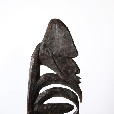 Male Yipwon Figural Carved Wood Sculpture on Stone Base