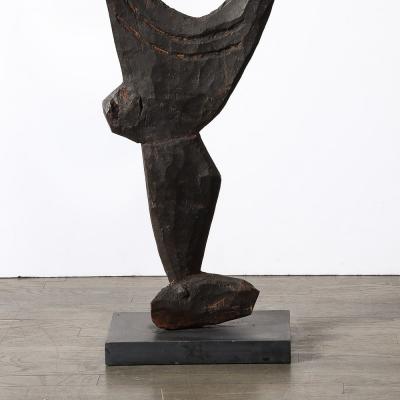 Male Yipwon Figural Carved Wood Sculpture on Stone Base
