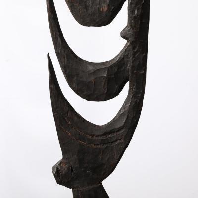 Male Yipwon Figural Carved Wood Sculpture on Stone Base