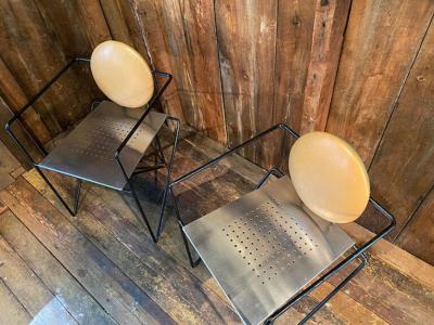 Mario Botta PAIR OF STAINLESS STEEL AND LEATHER ARMCHAIRS IN THE MANNER OF MARIO BOTTA