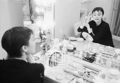 Mark Shaw Audrey Hepburn Applies Makeup in Two Mirrors with Eyes Closed