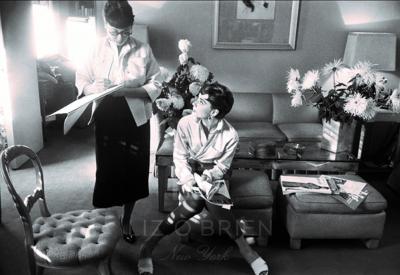 Mark Shaw Audrey Hepburn Consults with Costumer Head Up 1953