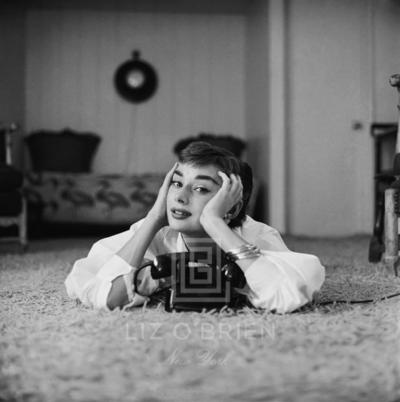 Mark Shaw Audrey Hepburn in White Blouse with Phone Laying Hands on Face 1953