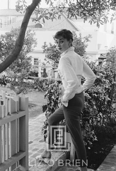 Mark Shaw Audrey Hepburn strolls in front of her Beverly Hills apartment 1953