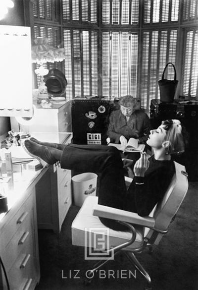 Mark Shaw Audrey Hepburn with Feet Up in Dressing Room Head Back 1953