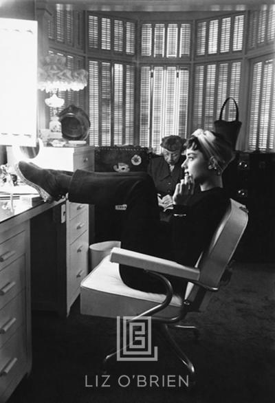 Mark Shaw Audrey Hepburn with Feet Up in Dressing Room Head Forward 1953