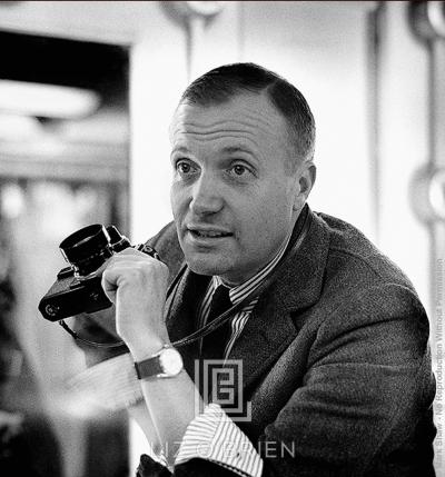 Mark Shaw Mark Shaw Portrait in Striped Shirt with Camera