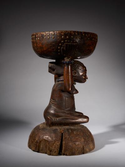 Massive and Robust Zela Caryatide Stool held by a Female sculpture