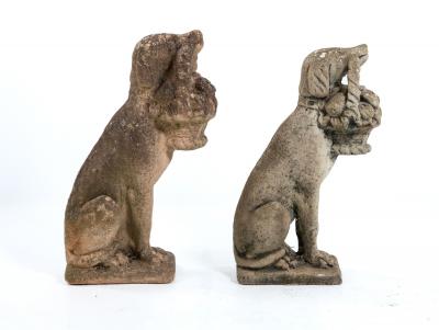 Matched Pair of Composite Stone Dogs with Fruit Baskets England Mid 20th C 