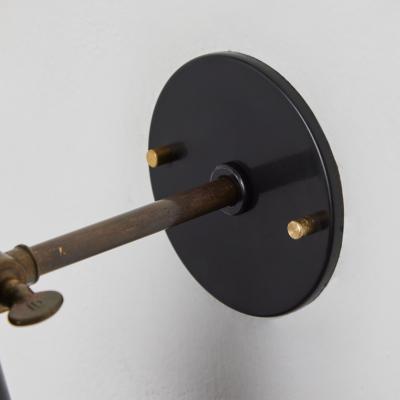 Mauri Almari 1950s Perforated Black Metal Diabolo Wall Lamp Attributed to Mauri Almari