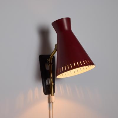 Mauri Almari 1950s Perforated Red Diabolo Plug In Wall Lamp Attributed to Mauri Almari