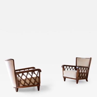 Maurizio Tempestini Pair of armchairs in shaped wood and padded fabric