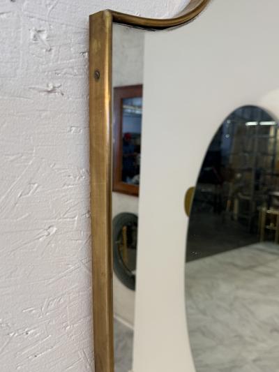 Mid Century Brass Framed Wall Mirror with Curved Silhouette 1960s