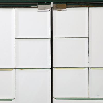 Mid Century Modernist Cabinet in Tessellated Beveled Mirror Panels