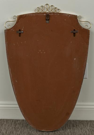 Mid Century Oval Shield Shaped Mirror With Decorative Scrolls