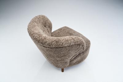 Mid Century Scandinavian Lounge Chair in Sheepskin Scandinavia circa 1950s