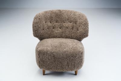 Mid Century Scandinavian Lounge Chair in Sheepskin Scandinavia circa 1950s