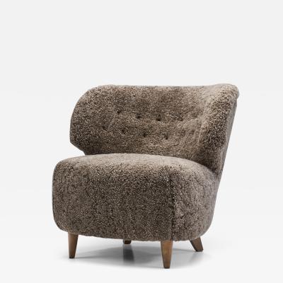 Mid Century Scandinavian Lounge Chair in Sheepskin Scandinavia circa 1950s