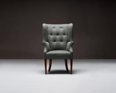 Mid Century Wingback Chair with Brass Buttons United States c 1950