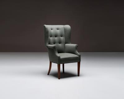 Mid Century Wingback Chair with Brass Buttons United States c 1950