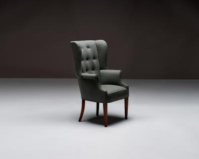 Mid Century Wingback Chair with Brass Buttons United States c 1950