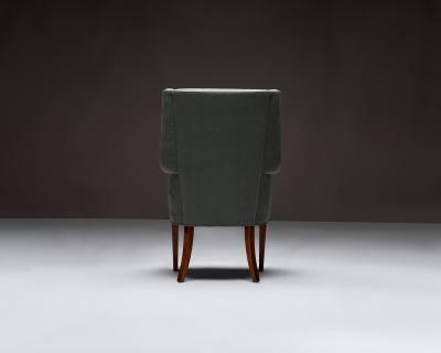 Mid Century Wingback Chair with Brass Buttons United States c 1950
