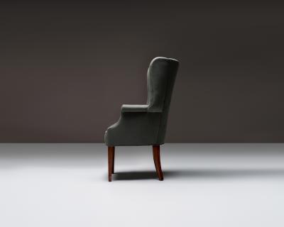 Mid Century Wingback Chair with Brass Buttons United States c 1950