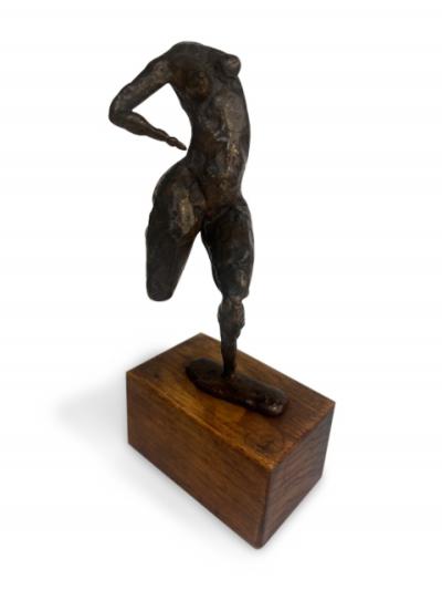 Mid Century small bronze contorting female nude on a wood base