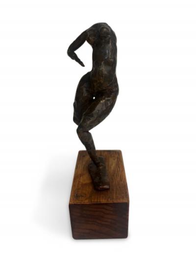 Mid Century small bronze contorting female nude on a wood base