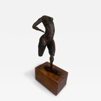 Mid Century small bronze contorting female nude on a wood base