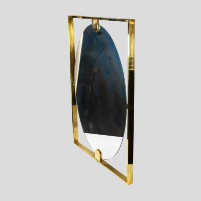 Mid century style rectangular brass frame with oval mirror