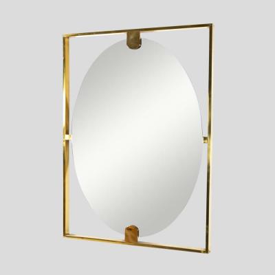 Mid century style rectangular brass frame with oval mirror