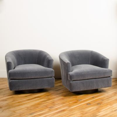 Milo Baughman A pair of Mid Century barrel back swivel chairs in the manner of Milo Baughman