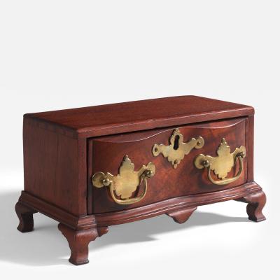 Miniature reverse serpentine front valuables chest