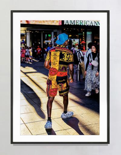 Mitchell Funk Man in Colorful African Theme Clothes Illuminated by Shaft of Light