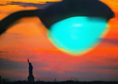 Mitchell Funk Statue of Liberty New York Harbor at Sunset with Green Light