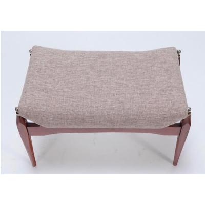 Modernist stool with brass finials