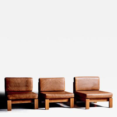 Modular seating group of three lounge chairs in oak and leather