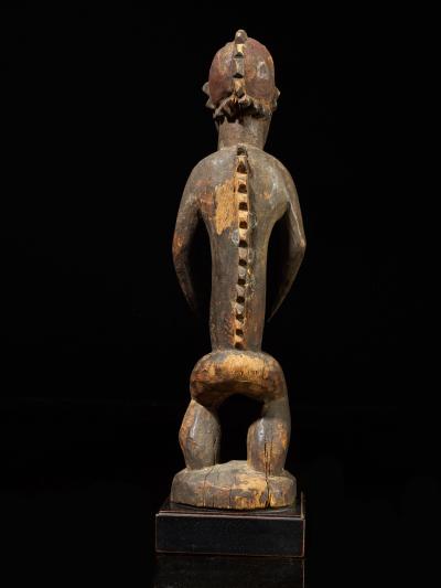 Montol Goemai Wooden Statue wearing Gugwom like mask