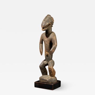 Montol Goemai Wooden Statue wearing Gugwom like mask
