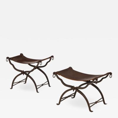 Morgan Colt Pair of wrought iron and leather curule stools by Morgan Colt