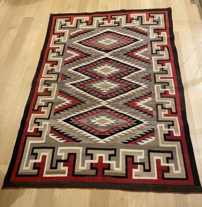 Navajo Dine Regional rug with eyedazzler design in the center